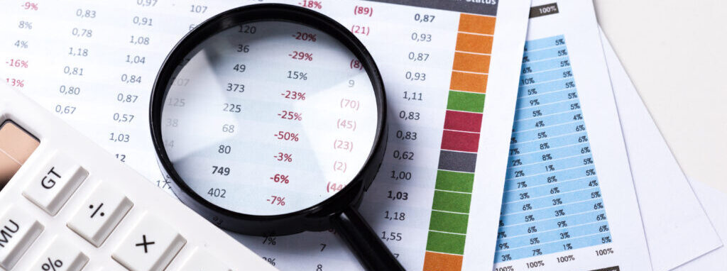 work with a magnifying glass, a calculator and papers